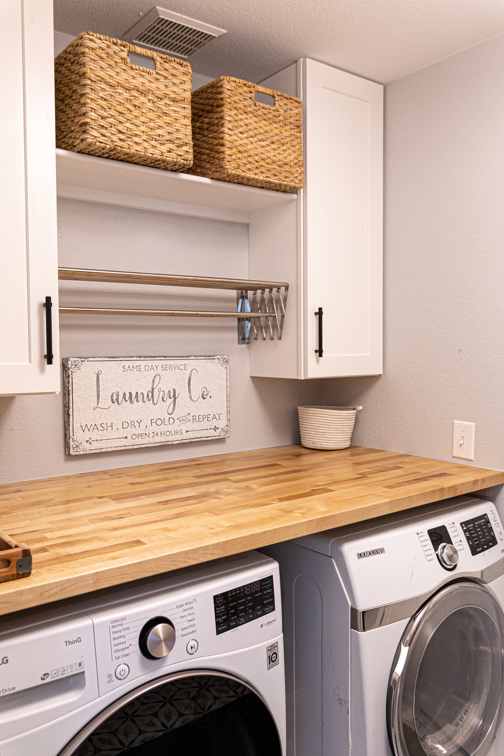 Laundry area with countertop and storage baskets